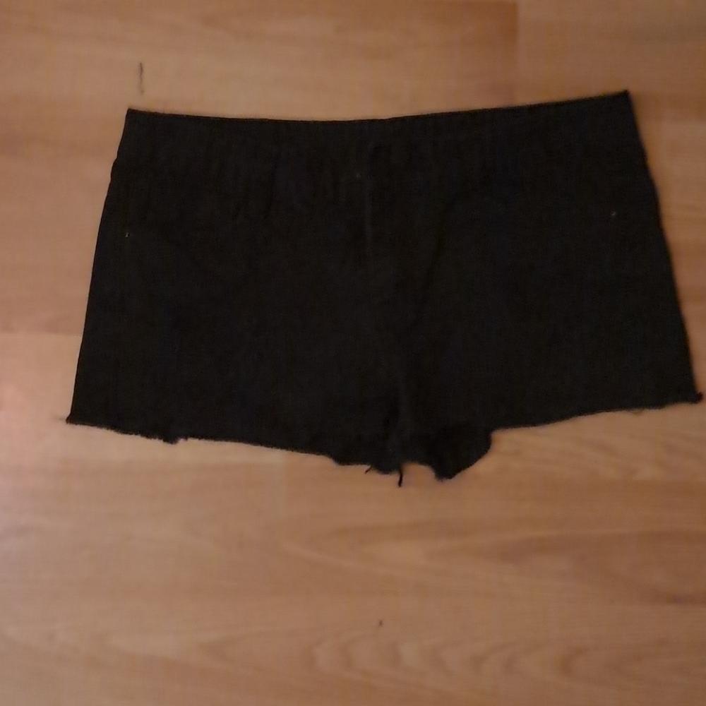 Black cutoff denim shorts runs small
